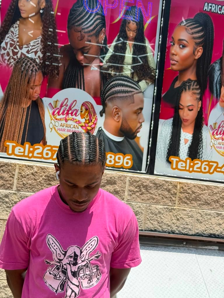 Freshly styled twists in front of the Difa signage